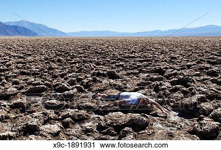 A Thirsty Man at Devil's Golf Course in Death Valley NP, USA View Large Photo Image Stock Image - A Thirsty Man at Devil's Golf Course in Death Valley NP, USA. Fotosearch