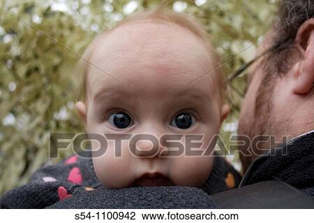A three-month old baby gorl looks over her fathers shoulder. View Large Photo Image Stock Image - A three-month old baby gorl looks over her fathers shoulder.. Fotosearch