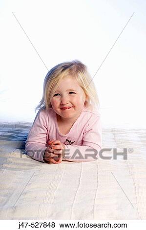 a three year old girl sitting i on the floor in the studio View Large Photo Image Stock Photo - a three year old girl sitting i on the floor in the studio. Fotosearch