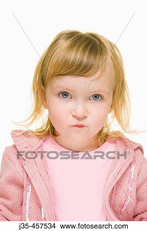 A three year old girl with blonde hair and blue eyes wearing a pink sweater and a pink top looks into camera with a concerned expression. View Large Photo Image Picture - A three year old girl with blonde hair and blue eyes wearing a pink sweater and a pink top looks into camera with a concerned expression.. Fotosearch