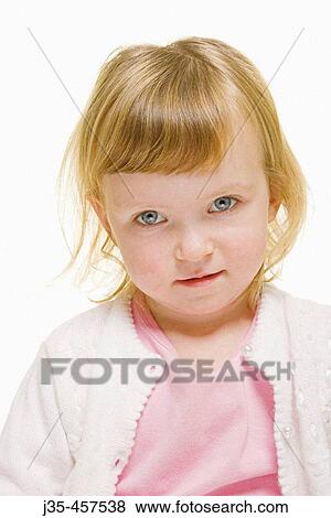 A three year old girl with blonde hair wearing a white sweater and a pink top looks into camera with a cute expression. View Large Photo Image Stock Photo - A three year old girl with blonde hair wearing a white sweater and a pink top looks into camera with a cute expression.. Fotosearch