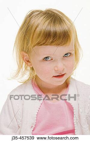 A three year old girl with blonde hair wearing a white sweater and a pink top looks into camera with a cute expression. View Large Photo Image Stock Photo - A three year old girl with blonde hair wearing a white sweater and a pink top looks into camera with a cute expression.. Fotosearch