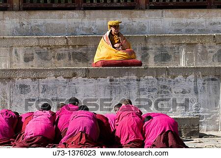 Stock Image - A Tibetan Buddhist ceremony conducted by a high Lama at Labrang monastery.. Fotosearch