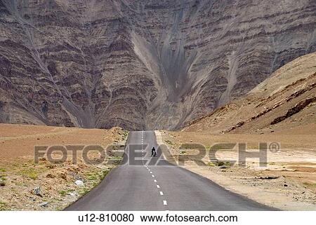 A Tourist is driving a Enfield in the Himalayas. View Large Photo Image Stock Image - A Tourist is driving a Enfield in the Himalayas.. Fotosearch