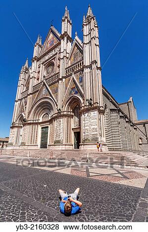 A Tourist Taking Photographs Of The Duomo, Orvieto, Umbria, Italy. View Large Photo Image Stock Photo - A Tourist Taking Photographs Of The Duomo, Orvieto, Umbria, Italy.. Fotosearch