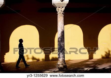 Stock Photo - A tourist walks in the Mosque and Cathedral of Cordoba, Andalusia, Spain.. Fotosearch