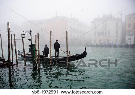 A Traghetto crosses the Grand Canal in Venice covered in thick fog, Italy. View Large Photo Image Stock Image - A Traghetto crosses the Grand Canal in Venice covered in thick fog, Italy.. Fotosearch