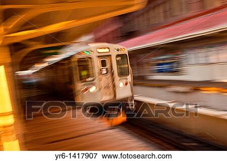 A train in the Chicago rapid transit system known as the? L? arrives in a station in the LOOP in Chicago, IL, USA View Large Photo Image Stock Photo - A train in the Chicago rapid transit system known as the? L? arrives in a station in the LOOP in Chicago, IL, USA. Fotosearch