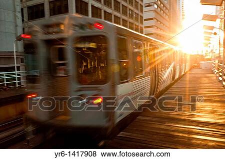 A train in the Chicago rapid transit system known as the? L? arrives in a station in the LOOP in Chicago, IL, USA View Large Photo Image Stock Photo - A train in the Chicago rapid transit system known as the? L? arrives in a station in the LOOP in Chicago, IL, USA. Fotosearch