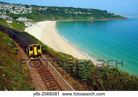 a train leaves st. ives along the coastal track in cornwall, england, uk. View Large Photo Image Stock Image - a train leaves st. ives along the coastal track in cornwall, england, uk.. Fotosearch