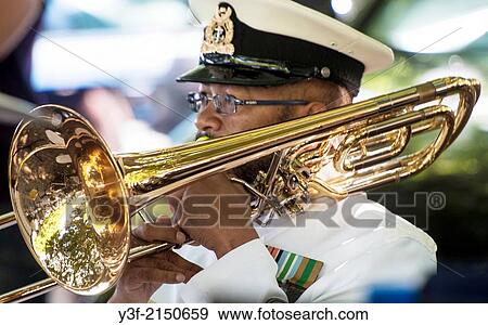 A trombone player in the South African Naval Band. On Parade! View Large Photo Image Stock Photo - A trombone player in the South African Naval Band. On Parade!. Fotosearch