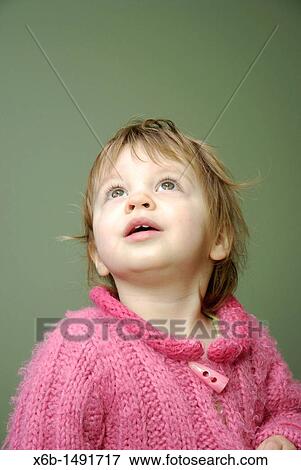A twenty month old girl looking up with an expression of interest View Large Photo Image Stock Photo - A twenty month old girl looking up with an expression of interest. Fotosearch