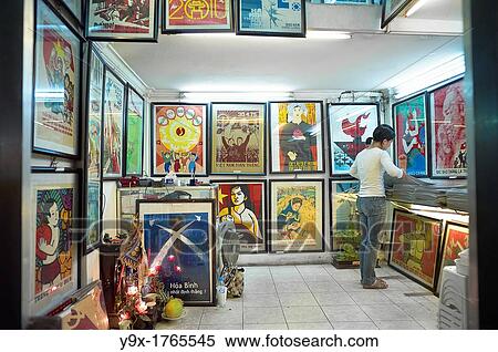A two-story propaganda poster shop in Vietnam with people browsing through the posters View Large Photo Image Stock Photography - A two-story propaganda poster shop in Vietnam with people browsing through the posters. Fotosearch