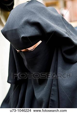 Picture - A veiled woman in Egypt.. Fotosearch