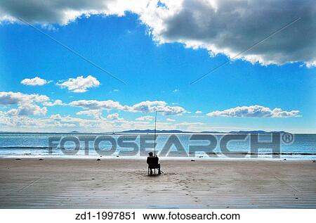 A very old man fishing a the beach. View Large Photo Image Stock Image - A very old man fishing a the beach.. Fotosearch