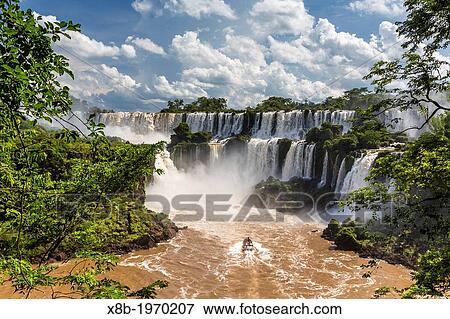 A view of Iguaz Falls from the lower trail, Iguaz Falls National Park, Misiones, Argentina, South America. View Large Photo Image Stock Photo - A view of Iguaz Falls from the lower trail, Iguaz Falls National Park, Misiones, Argentina, South America.. Fotosearch