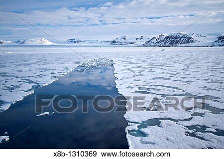 A view of Krossfjorden cross fjord on the northwestern side of Spitsbergen Island in the Svalbard Archipelago, Norway View Large Photo Image Stock Photo - A view of Krossfjorden cross fjord on the northwestern side of Spitsbergen Island in the Svalbard Archipelago, Norway. Fotosearch