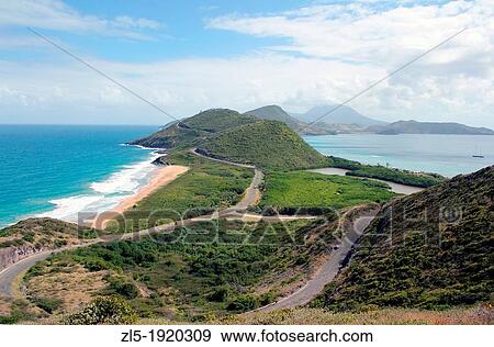 A view of the Atlantic Ocean and the Caribbean Sea as seen from a vantage point on the separating Caribbean island of St Kitts View Large Photo Image Stock Photo - A view of the Atlantic Ocean and the Caribbean Sea as seen from a vantage point on the separating Caribbean island of St Kitts. Fotosearch