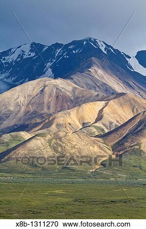 A view of the Polychrome many-colored Mountains from a lookout point on the park road inside Denali National Park and Preserve, Alaska, USA View Large Photo Image Stock Image - A view of the Polychrome many-colored Mountains from a lookout point on the park road inside Denali National Park and Preserve, Alaska, USA. Fotosearch