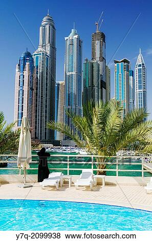 A view over Dubai Marina, from a hotel pool, Dubai, United Arab Emirates. View Large Photo Image Stock Photo - A view over Dubai Marina, from a hotel pool, Dubai, United Arab Emirates.. Fotosearch