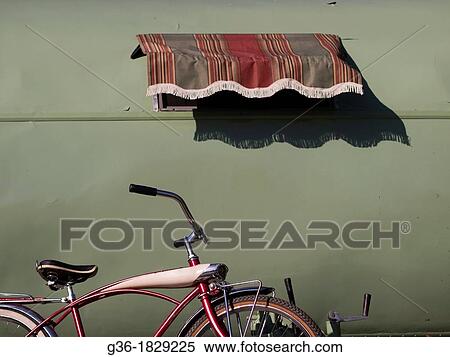 A vintage bicycle sits outside a green trailer in Santa Barbara, California, United States View Large Photo Image Stock Photography - A vintage bicycle sits outside a green trailer in Santa Barbara, California, United States. Fotosearch
