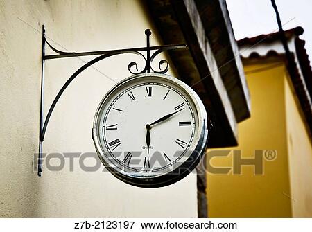 A watch on a wall in Great Canary Island, Spain. View Large Photo Image Stock Photo - A watch on a wall in Great Canary Island, Spain.. Fotosearch