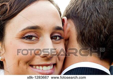 A wfe looks over her husband's shoulder as she embraces him View Large Photo Image Stock Photo - A wfe looks over her husband's shoulder as she embraces him. Fotosearch