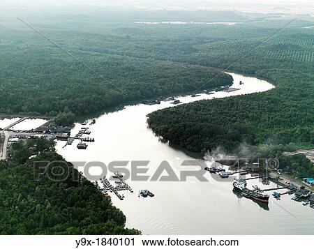 A winding river and boats cutting through the Jungle View Large Photo Image Stock Image - A winding river and boats cutting through the Jungle. Fotosearch