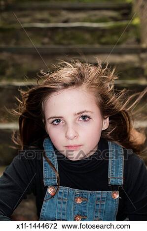 A windswept moody 12 - 13 year old teenage girl, UK View Large Photo Image Stock Image - A windswept moody 12 - 13 year old teenage girl, UK. Fotosearch