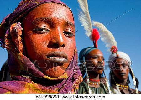 Stock Photo - A Wodaabe-Bororo man with his face painted for the annual Gerewol Diffa Sahel Niger. Fotosearch