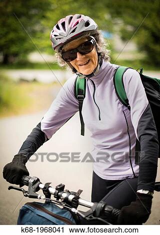 A woman, 75, with her bicycle on Saturna Island, Gulf Islands, British Columbia, Canada View Large Photo Image Stock Image - A woman, 75, with her bicycle on Saturna Island, Gulf Islands, British Columbia, Canada. Fotosearch