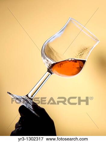 A woman drinks in a glass of red wine in Taramilla winery in Prado del Rey, Cadiz province, Andalusia, Spain, April 25, 2010 View Large Photo Image Stock Photo - A woman drinks in a glass of red wine in Taramilla winery in Prado del Rey, Cadiz province, Andalusia, Spain, April 25, 2010. Fotosearch