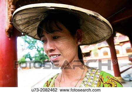 Stock Image - A woman from Shan state wearing a traditional hat.. Fotosearch