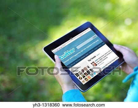 A woman hand holding an iPad showing Twitter screen View Large Photo Image Stock Image - A woman hand holding an iPad showing Twitter screen. Fotosearch