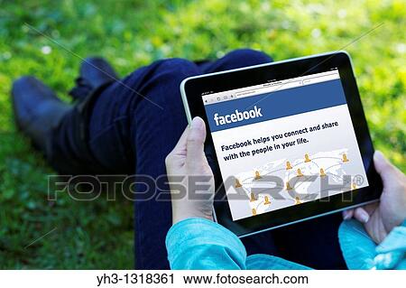 A woman hand holding an iPad while showing Facebook screen View Large Photo Image Stock Image - A woman hand holding an iPad while showing Facebook screen. Fotosearch