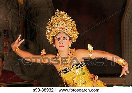 A woman in a traditional costume dancing a Balinese dance in Ubud. View Large Photo Image Stock Image - A woman in a traditional costume dancing a Balinese dance in Ubud.. Fotosearch