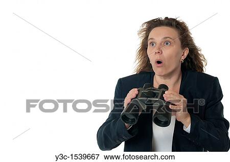 A woman in business attire with binoculars, shocked and outraged View Large Photo Image Stock Photo - A woman in business attire with binoculars, shocked and outraged. Fotosearch