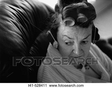 A woman in her curlers. View Large Photo Image Stock Image - A woman in her curlers.. Fotosearch