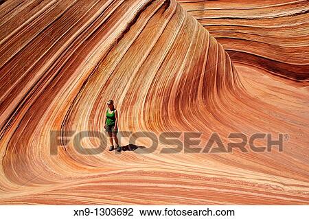 A woman in the Wave, Vermilion North Coyote Buttes, Paria Canyon-Vermilion Cliffs Wilderness, Vermilion National Monument, Arizona, USA View Large Photo Image Stock Image - A woman in the Wave, Vermilion North Coyote Buttes, Paria Canyon-Vermilion Cliffs Wilderness, Vermilion National Monument, Arizona, USA. Fotosearch