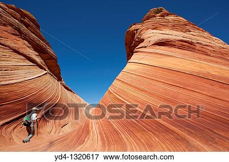 A woman in the Wave, Vermilion North Coyote Buttes, Paria Canyon-Vermilion Cliffs Wilderness, Vermilion National Monument, Arizona, USA View Large Photo Image Stock Photo - A woman in the Wave, Vermilion North Coyote Buttes, Paria Canyon-Vermilion Cliffs Wilderness, Vermilion National Monument, Arizona, USA. Fotosearch