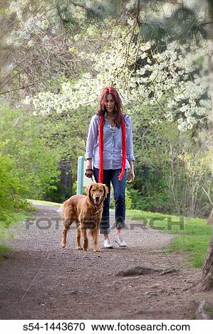 A woman outdoors with her Golden Retriever View Large Photo Image Stock Image - A woman outdoors with her Golden Retriever. Fotosearch