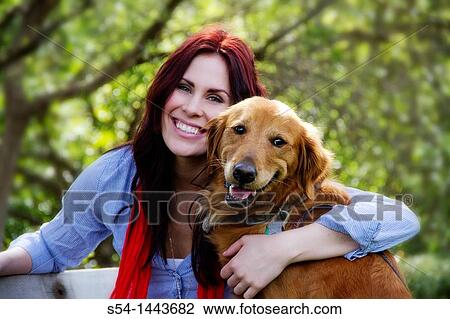 A woman outdoors with her Golden Retriever View Large Photo Image Stock Image - A woman outdoors with her Golden Retriever. Fotosearch