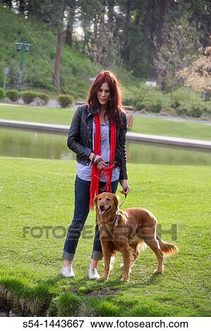 A woman outdoors with her Golden Retriever View Large Photo Image Stock Photo - A woman outdoors with her Golden Retriever. Fotosearch