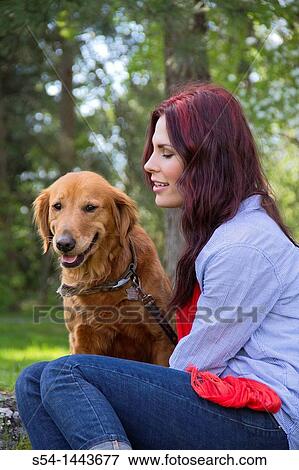 A woman outdoors with her Golden Retriever View Large Photo Image Stock Photo - A woman outdoors with her Golden Retriever. Fotosearch