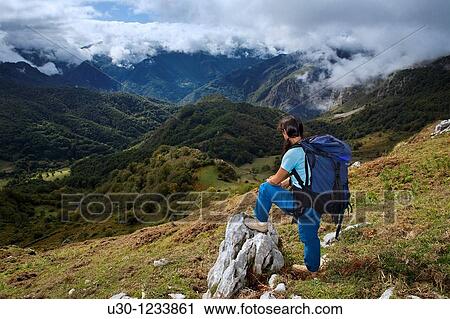 A woman practicing mountaineering in the Cornion massif, in the Picos de Europa National Park, Sajambre Valley, Leon, Castilla y Leon Spain View Large Photo Image Stock Image - A woman practicing mountaineering in the Cornion massif, in the Picos de Europa National Park, Sajambre Valley, Leon, Castilla y Leon Spain. Fotosearch