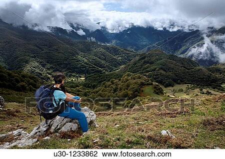 A woman practicing mountaineering in the Cornion massif, in the Picos de Europa National Park, Sajambre Valley, Leon, Castilla y Leon Spain View Large Photo Image Stock Image - A woman practicing mountaineering in the Cornion massif, in the Picos de Europa National Park, Sajambre Valley, Leon, Castilla y Leon Spain. Fotosearch