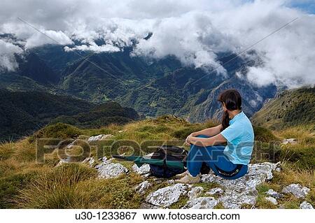 A woman practicing mountaineering in the Cornion massif, in the Picos de Europa National Park, Sajambre Valley, Leon, Castilla y Leon Spain View Large Photo Image Stock Photo - A woman practicing mountaineering in the Cornion massif, in the Picos de Europa National Park, Sajambre Valley, Leon, Castilla y Leon Spain. Fotosearch