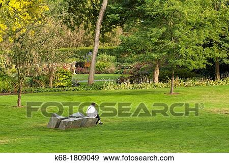 a woman reads in the VanDusen Garden in Vancouver, BC, Canada View Large Photo Image Stock Photo - a woman reads in the VanDusen Garden in Vancouver, BC, Canada. Fotosearch
