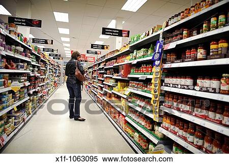 A woman shopping on her own in a Somerfield supermarket, UK View Large Photo Image Stock Photography - A woman shopping on her own in a Somerfield supermarket, UK. Fotosearch