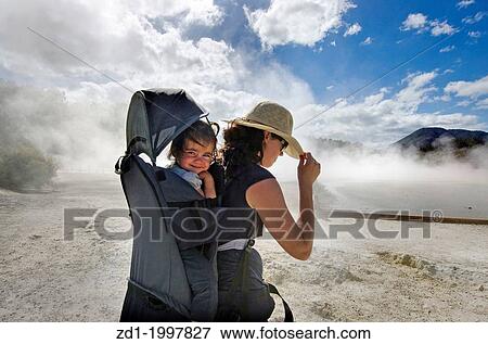 A woman travel with her baby at the Champagne Pool in Wai-O-Tapu Geothermal Wonderland, Rotorua, New Zealand. View Large Photo Image Stock Photo - A woman travel with her baby at the Champagne Pool in Wai-O-Tapu Geothermal Wonderland, Rotorua, New Zealand.. Fotosearch
